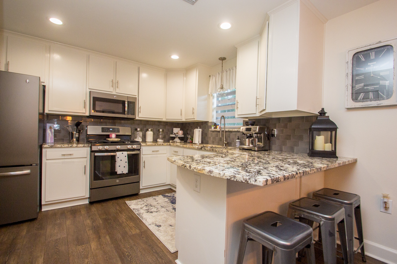 Luxury Vinyl Tile, Granite counters, and Stainless appliances in this remodeled Bear Point Home for sale